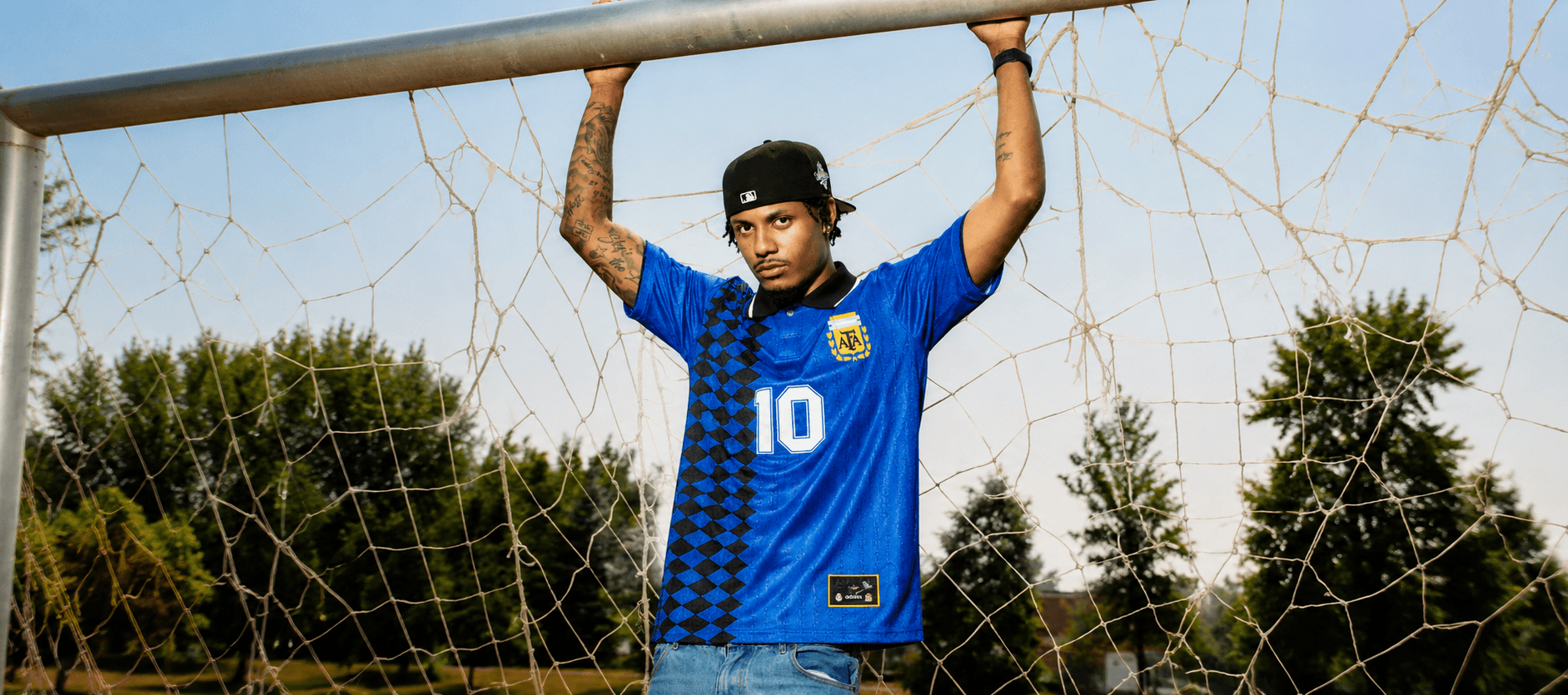 Model wearing a classic Argentina retro jersey on the pitch